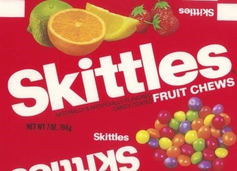 Skittles packaging from 1981, featuring fresh fruit and Skittles pieces.